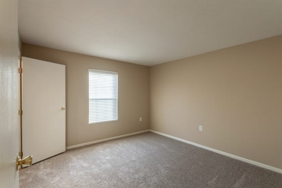 This is a photo of the primary bedroom in the 890 square foot 2 bedroom, 1 bath Liberty (lower) at Washington Place Apartments in Miamisburg, Ohio in Washington Township.