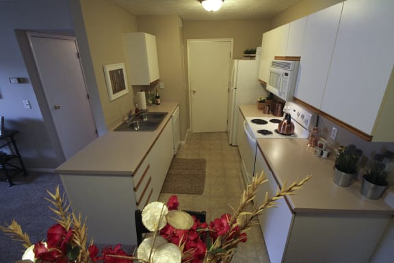 This is a photo of the kitchen of the 890 square foot 2 bedroom Liberty at Washington Place Apartments in Centerville, OH.