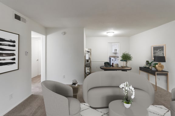 This is a photo of a virtually staged living room in the 751 square foot 1 bedroom, 1 bath apartment with fireplace at Woodbridge Apartments in Dallas, TX.