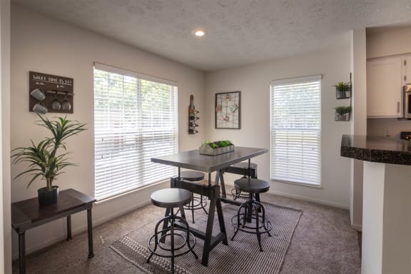 This is a photo of the dining room of the 1100 square foot 2 bedroom Kettering floor plan at Washington Park Apartments in Centerville, OH.