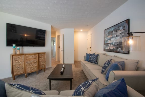 This is a photo of the living room of the 1100 square foot 2 bedroom Kettering floor plan at Washington Park Apartments in Centerville, OH.