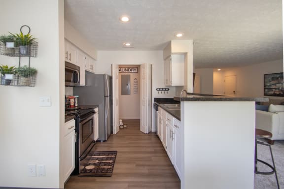 This is a photo of the kitchen of the 1100 square foot 2 bedroom Kettering floor plan at Washington Park Apartments in Centerville, OH.