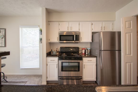 This is a photo of the kitchen of the 1100 square foot 2 bedroom Kettering floor plan at Washington Park Apartments in Centerville, OH.