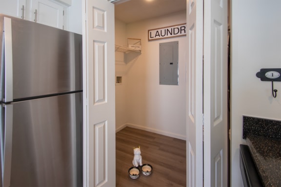 This is a photo of the utility closet with full-size washer /dryer connections of the 1100 square foot 2 bedroom Kettering floor plan at Washington Park Apartments in Centerville, OH.