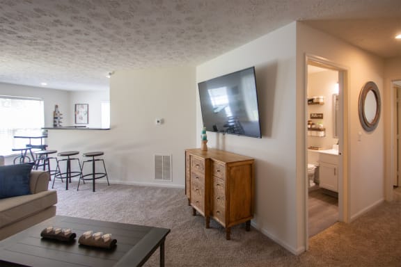 This is a photo of the living room and hallway of the 1100 square foot 2 bedroom Kettering floor plan at Washington Park Apartments in Centerville, OH.
