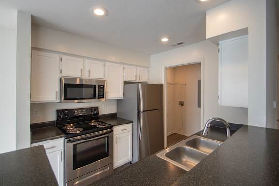 This is a photo of the kitchen of the 900 square foot 2 bedroom Miamisburg floor plan at Washington Park Apartments in Centerville, OH.