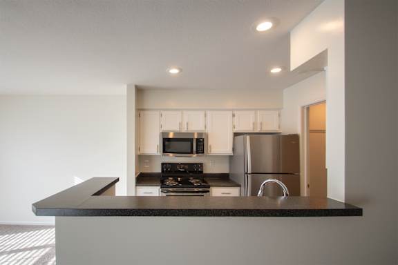 This is a photo of the kitchen of the 900 square foot 2 bedroom Miamisburg floor plan at Washington Park Apartments in Centerville, OH.