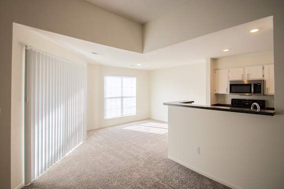 This is a photo of the kitchen and dining room of the 900 square foot 2 bedroom Miamisburg floor plan at Washington Park Apartments in Centerville, OH.