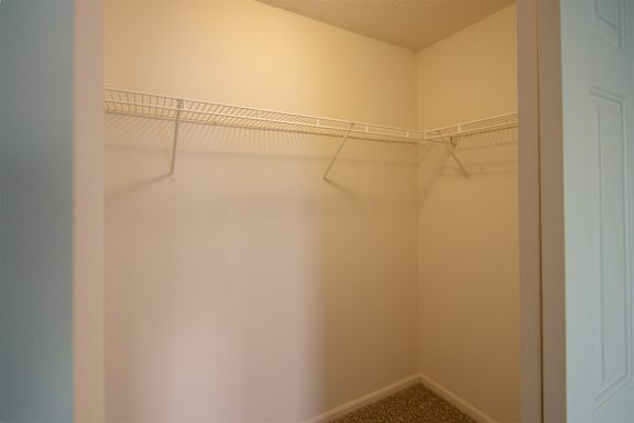 This is a photo of the large closet in the bedroom of the 900 square foot 2 bedroom Miamisburg floor plan at Washington Park Apartments in Centerville, OH.