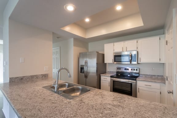 This is a photo of the kitchen of the 1500 square foot 3 bedroom, 2 and a half bath with 2-car garage Bellbrook floor plan at Washington Park Apartments in Centerville, OH.