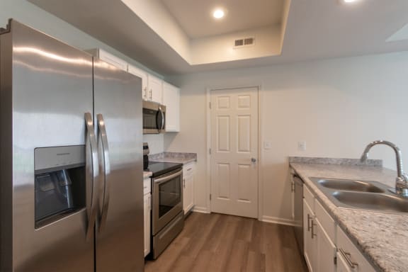 This is a photo of the kitchen of the 1500 square foot 3 bedroom, 2 and a half bath with 2-car garage Bellbrook floor plan at Washington Park Apartments in Centerville, OH.