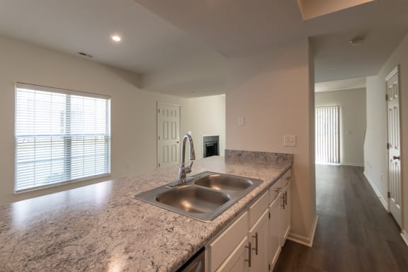 This is a photo of the kitchen of the 1500 square foot 3 bedroom, 2 and a half bath with 2-car garage Bellbrook floor plan at Washington Park Apartments in Centerville, OH.