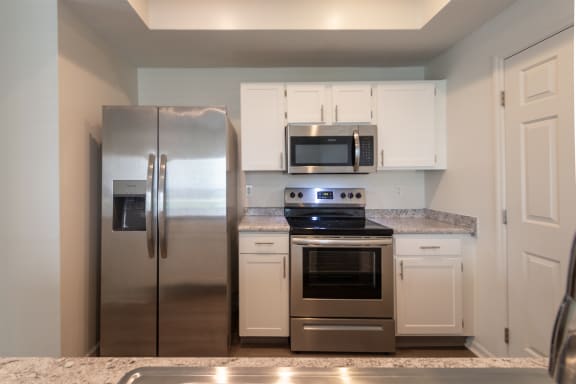 This is a photo of the kitchen of the 1500 square foot 3 bedroom, 2 and a half bath with 2-car garage Bellbrook floor plan at Washington Park Apartments in Centerville, OH.