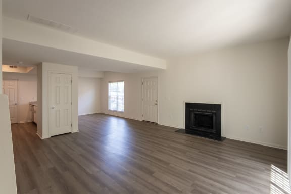 This is a photo of the living room with fireplace of the 1500 square foot 3 bedroom, 2 and a half bath with 2-car garage Bellbrook floor plan at Washington Park Apartments in Centerville, OH.