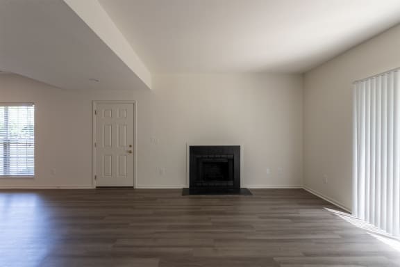 This is a photo of the living room with fireplace of the 1500 square foot 3 bedroom, 2 and a half bath with 2-car garage Bellbrook floor plan at Washington Park Apartments in Centerville, OH.