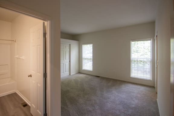 This is a photo of the primary bedroom of the 1500 square foot 3 bedroom, 2 and a half bath with 2-car garage Bellbrook floor plan at Washington Park Apartments in Centerville, OH.