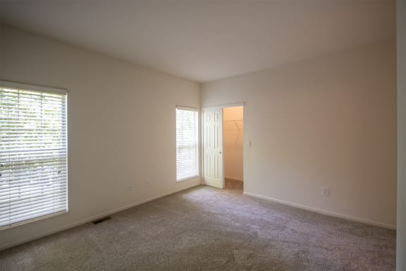 This is a photo of the primary bedroom of the 1500 square foot 3 bedroom, 2 and a half bath with 2-car garage Bellbrook floor plan at Washington Park Apartments in Centerville, OH.