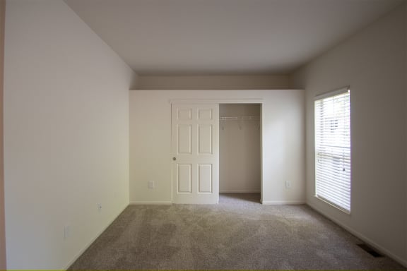 This is a photo of the primary bedroom of the 1500 square foot 3 bedroom, 2 and a half bath with 2-car garage Bellbrook floor plan at Washington Park Apartments in Centerville, OH.