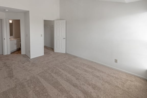 This is a photo of the primary bedroom of the 1100 square foot 2 bedroom, 2 bath Eaton floor plan at Washington Park Apartments in Centerville, OH.