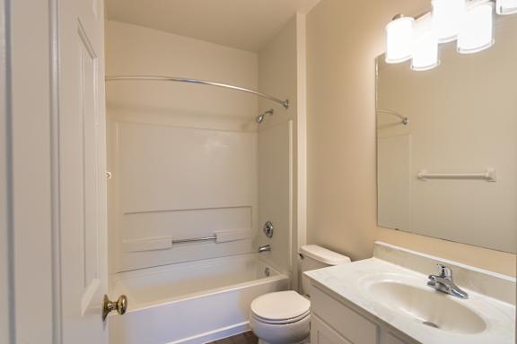 The primary bathroom in the 1280 square foot, 2 bedroom, 2 and a half bath Oakwood floor plan  at Washington Park Apartments, in Centerville, OH.