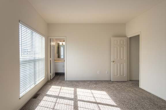 The bedroom in the 1280 square foot, 2 bedroom, 2 and a half bath Oakwood floor plan  at Washington Park Apartments, in Centerville, OH.