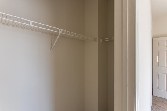 The second bedroom closet in the 1280 square foot, 2 bedroom, 2 and a half bath Oakwood floor plan  at Washington Park Apartments, in Centerville, OH.