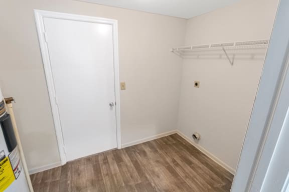 This is a photo of the utility room with washer and dryer connections of the 1280 square foot 2 bedroom, 2 and 1/2 bath Oakwood floor plan at Washington Park Apartments in Centerville, OH.