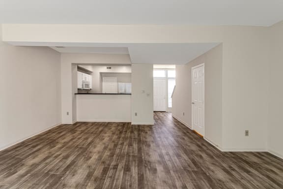 This is a photo of the living room and dining area of the 1280 square foot 2 bedroom, 2 and 1/2 bath Oakwood floor plan at Washington Park Apartments in Centerville, OH.