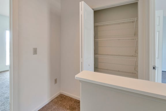 This is a photo of the upstairs hallway of the 1280 square foot 2 bedroom, 2 and 1/2 bath Oakwood floor plan at Washington Park Apartments in Centerville, OH.