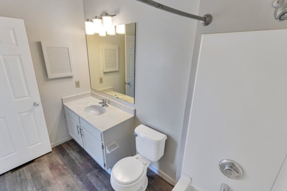 This is a photo of the second bedroom full bath in the 1280 square foot 2 bedroom, 2 and 1/2 bath Oakwood floor plan at Washington Park Apartments in Centerville, OH.