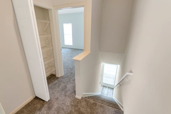 This is a photo of the linen closet in the upstairs hallway of the 1280 square foot 2 bedroom, 2 and 1/2 bath Oakwood floor plan at Washington Park Apartments in Centerville, OH.