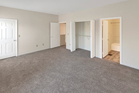 This is a photo of the primary bedroom of the 1280 square foot 2 bedroom, 2 and 1/2 bath Oakwood floor plan at Washington Park Apartments in Centerville, OH.