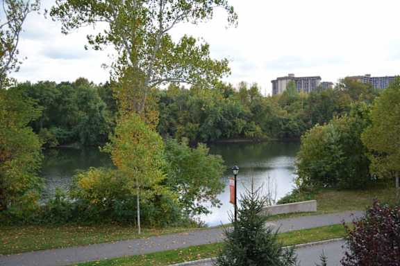 A park with a lake and trees at Riverview Landing @ Valley Forge, Eagleville, PA 19403