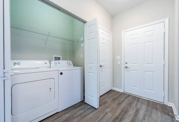 A laundry room with a washer and dryer.at Riverview Landing @ Valley Forge, Pennsylvania