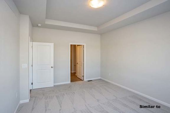a empty living room with a door to a hallway at Two Rivers Home Rentals, Iowa