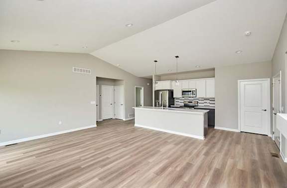 a large living room with a kitchen and a at Two Rivers Home Rentals, Iowa