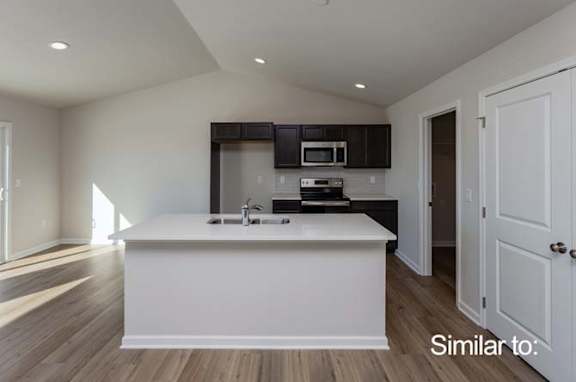 an empty kitchen with a white counter top at Two Rivers Home Rentals, West Des Moines, 50266