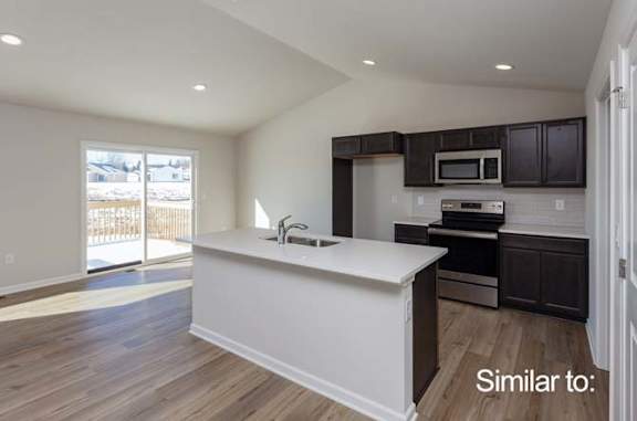 an empty kitchen with a white counter top at Two Rivers Home Rentals, West Des Moines, 50266
