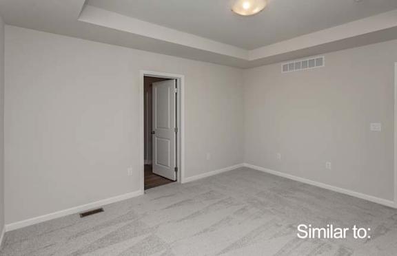 a empty room with a door to a white room at Two Rivers Home Rentals, Iowa