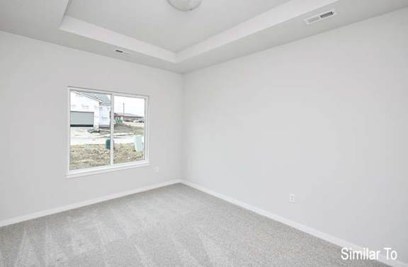 an empty living room with a large window at Two Rivers Home Rentals, West Des Moines, Iowa