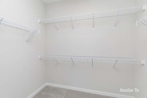 Empty white shelves in a room. at Two Rivers Home Rentals, West Des Moines, IA 50266