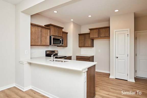 an empty kitchen with a white counter top at Two Rivers Home Rentals, Iowa