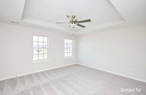 an empty living room with a ceiling fan at Two Rivers Home Rentals, West Des Moines, Iowa