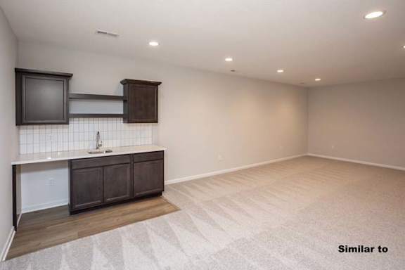 a empty room with a sink and a counter in it at Two Rivers Home Rentals, Iowa 50266