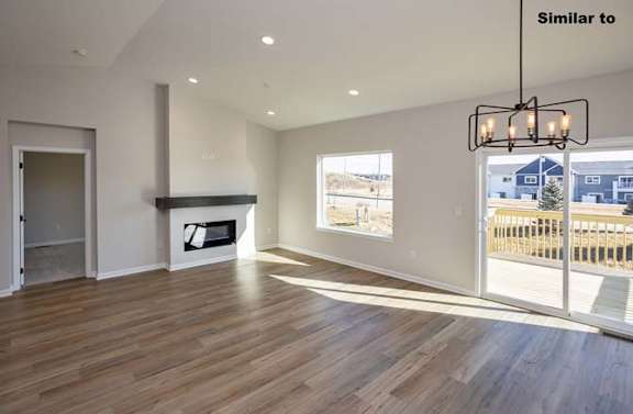 a living room with a view of a staircase at Two Rivers Home Rentals, West Des Moines