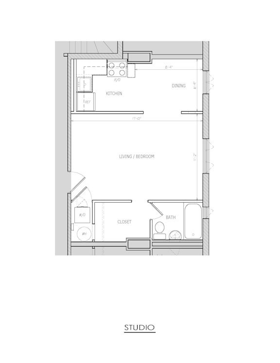 A floor plan of a studio apartment with a kitchen, living/bedroom area, and a bathroom.