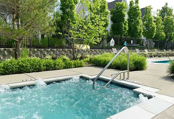 Secured Swimming Pool with a hot tub at Encore Townhomes, Utica, MI, 48315