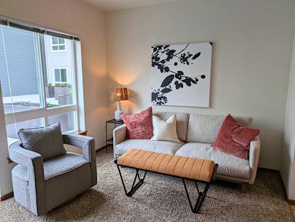 Furnished living room with sofa and armchairs at Ovation at Paine Field