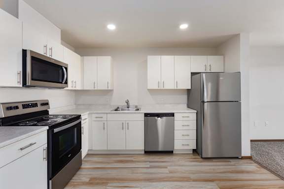 White cabinets and stainless appliances at Ovation at Paine Field