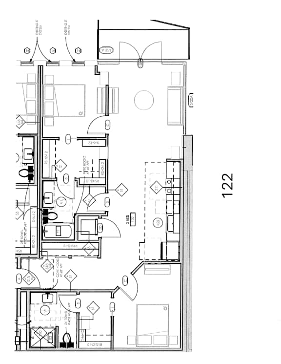 A floor plan of a house with a kitchen, living room, and bathrooms.